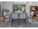 Dining room featuring a wood table with seating for six and sliding glass doors at 3899 Carlton Dr, Chamblee, GA 30341