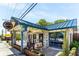 Inviting Bluedrop Restaurant featuring a brick facade, blue trim, outdoor seating, and planters at 3899 Carlton Dr, Chamblee, GA 30341
