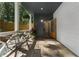 Inviting covered front porch with wood-look ceiling, stylish seating, and a view to the front door at 3899 Carlton Dr, Chamblee, GA 30341