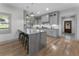 Modern kitchen featuring a marble island, grey cabinets and pendant lighting at 3899 Carlton Dr, Chamblee, GA 30341