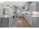 Bright kitchen featuring marble countertops, grey cabinets and stainless steel appliances at 3899 Carlton Dr, Chamblee, GA 30341