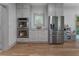 Bright kitchen featuring stainless steel appliances, double ovens, and grey shaker cabinets at 3899 Carlton Dr, Chamblee, GA 30341