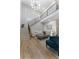 Spacious, bright living room features a staircase, modern furniture, and an airy, comfortable design at 3899 Carlton Dr, Chamblee, GA 30341