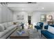 Bright, open living room with white walls, modern furniture, and natural light from the window at 3899 Carlton Dr, Chamblee, GA 30341