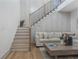 Bright living room features a staircase, contemporary decor, and a comfortable seating arrangement at 3899 Carlton Dr, Chamblee, GA 30341