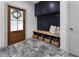 Well-designed mudroom with custom cabinets, seating, storage baskets, and stylish flooring at 3899 Carlton Dr, Chamblee, GA 30341