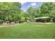 Community playground featuring play structures, swings, and a covered picnic area at 3899 Carlton Dr, Chamblee, GA 30341