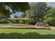 Community playground featuring play structures, swings, and a covered picnic area at 3899 Carlton Dr, Chamblee, GA 30341