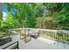 Spacious back deck features comfortable seating with a glass-top table perfect for entertaining at 501 Avery Creek Pointe, Woodstock, GA 30188