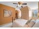 Sunny bedroom with neutral paint, a ceiling fan, built-in storage, and natural light from a window at 501 Avery Creek Pointe, Woodstock, GA 30188