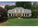 Beautiful one-story home with a large yard, classic brick accents, and a welcoming front porch at 501 Avery Creek Pointe, Woodstock, GA 30188