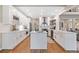 Modern kitchen with white cabinets, stainless steel appliances, and a center island at 501 Avery Creek Pointe, Woodstock, GA 30188