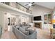 Open living room features a fireplace, built-in shelves, and comfortable seating at 501 Avery Creek Pointe, Woodstock, GA 30188