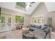 Bright living room with large windows, vaulted ceilings, and an open floor plan at 501 Avery Creek Pointe, Woodstock, GA 30188