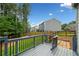Enjoy outdoor living on this deck with views of the lush backyard and neighboring homes at 115 Greenbrier Way, Canton, GA 30114