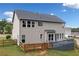 Spacious backyard with a privacy fence, complemented by a well-maintained home exterior and deck at 115 Greenbrier Way, Canton, GA 30114