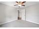 An airy bedroom featuring neutral walls, carpet, and a view of the doorway to the hall at 115 Greenbrier Way, Canton, GA 30114