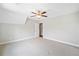 Bright bedroom featuring neutral walls, carpet, and a view of the doorway to the hall at 115 Greenbrier Way, Canton, GA 30114