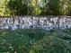 Stone sign for Great Sky neighborhood set amongst the trees and greenery at 115 Greenbrier Way, Canton, GA 30114