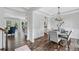 View of the dining room that shows the bright space, chandelier and kitchen at 115 Greenbrier Way, Canton, GA 30114