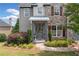 Charming home with a stone facade, landscaped front yard, and a covered entry way at 115 Greenbrier Way, Canton, GA 30114