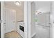 Convenient laundry room adjacent to bedroom, features modern appliances at 115 Greenbrier Way, Canton, GA 30114