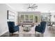 Inviting living room with plush seating, large windows, and access to the outdoors at 115 Greenbrier Way, Canton, GA 30114