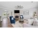 Open concept living area with cozy seating, stone fireplace, and a view of the entry at 115 Greenbrier Way, Canton, GA 30114