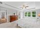 Main bedroom with trey ceilings featuring a dresser with a carpeted hall and bathroom view at 115 Greenbrier Way, Canton, GA 30114