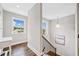 Stairway with hardwood steps, white trim, and natural light at 115 Greenbrier Way, Canton, GA 30114