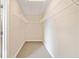 Spacious walk-in closet features carpeted floor and ample white shelving for maximum storage and organization at 115 Greenbrier Way, Canton, GA 30114