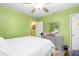 Bright bedroom with green walls and white bedding at 1776 Fairway Hill Se Dr, Atlanta, GA 30317
