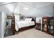 Charming bedroom features a four-poster bed and built-in bookshelves at 1776 Fairway Hill Se Dr, Atlanta, GA 30317