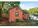 This single-story home features a well-maintained yard, mature trees and a bright exterior at 1776 Fairway Hill Se Dr, Atlanta, GA 30317