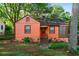 Charming single-story home with a landscaped front yard and colorful exterior at 1776 Fairway Hill Se Dr, Atlanta, GA 30317