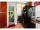 View of the kitchen with appliances and access to the sitting area with laundry at 1776 Fairway Hill Se Dr, Atlanta, GA 30317