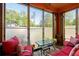 Inviting sunroom with large windows, comfortable seating, and natural light at 1776 Fairway Hill Se Dr, Atlanta, GA 30317