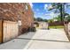 Paved backyard with outdoor storage and basketball hoop at 3024 Bridgehaven Ct, Snellville, GA 30039