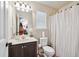 Bathroom with vanity, toilet, and shower with curtain at 3024 Bridgehaven Ct, Snellville, GA 30039