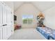 bedroom with vaulted ceiling, bright natural light, and fun decor at 3024 Bridgehaven Ct, Snellville, GA 30039