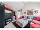 Upstairs bonus room decorated with Atlanta and Coca-Cola decor, and gray sectional at 3024 Bridgehaven Ct, Snellville, GA 30039