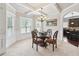 Elegant dining area with a chandelier, coffered ceiling, and direct access to the kitchen area at 3024 Bridgehaven Ct, Snellville, GA 30039