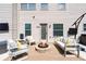 Outdoor patio with fire pit and cozy seating, perfect for entertaining at 3024 Bridgehaven Ct, Snellville, GA 30039
