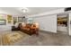 Spacious finished basement featuring an open layout and carpet, perfect for additional living and entertaining space at 4290 Inverness Ne Ct, Roswell, GA 30075