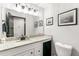 Tastefully updated bathroom features modern fixtures, granite countertops, and framed artwork at 4290 Inverness Ne Ct, Roswell, GA 30075