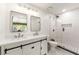 Modern bathroom featuring double sinks, sleek cabinetry, a glass-enclosed shower, and stylish finishes for a spa-like experience at 4290 Inverness Ne Ct, Roswell, GA 30075