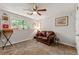 Bedroom providing a comfortable living space with a window view, decor, and ceiling fan at 4290 Inverness Ne Ct, Roswell, GA 30075