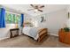 Well-lit bedroom features decor, neutral walls, and carpet, offering a comfortable and stylish living space at 4290 Inverness Ne Ct, Roswell, GA 30075