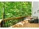 Well-maintained deck ideal for outdoor gatherings, complemented by lush greenery and natural lighting at 4290 Inverness Ne Ct, Roswell, GA 30075