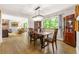 Bright dining room showcasing wood floors, a large window, and elegant furniture at 4290 Inverness Ne Ct, Roswell, GA 30075